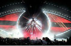 fireworks are lit up in the night sky at a concert