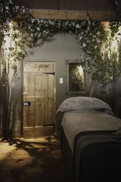 a room with a bed and plants growing on the wall next to it's door