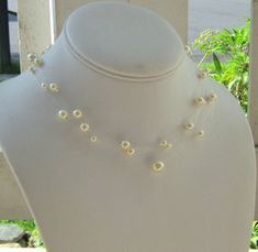 Pearl Illusion Necklace ~ This lovely multistrand pearl floating necklace is made with beautiful Swarovski pearls - perfect for any bride, bridesmaid, or flower girl!  I have combined varying sizes of Swarovski pearls and set them on clear illusion wire, creating the illusion of an invisible pearl necklace!  Can also be shortened for your flower girl! Makes a great gift for bridesmaids gifts!The bridal jewelry measures approximately 16 1/2" and extends to 18 1/2" with a lobster claw closure and Illusion Necklace, Gift For Bridesmaids, Floating Necklace, Necklace Bridal, Etsy Bridesmaid Gifts, Jewelry Bridal, Necklace Pearl, Swarovski Pearls, Bridal Necklace