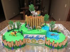 a cake made to look like a zoo scene