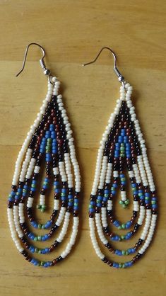 Hand-beaded, Southwest design on surgical steel ear wires.   Earrings measure 3 inches long (Not including ear wires) . 3/4 inches wide. Done with size #11 beads.  COLORS:  Opaque Black, Opaque Bone, Matte Antique Blue, picasso Red, Picasso Turquoise Green I can also custom make these in YOUR colors Indigenous Beaded Earrings, Blue Picasso, Beads Colors, Beaded Chandelier Earrings, Vert Turquoise, Southwest Design, Seed Bead Patterns, Nativity Crafts, Beaded Lanyards