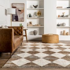 a living room filled with furniture and lots of shelves on top of each side of the wall