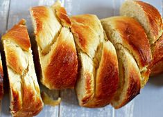 several pieces of bread sitting on top of a white table