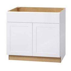 a white cabinet with two doors and one drawer on the bottom, in front of a white background