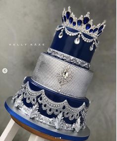 a stack of blue and silver wedding cakes on top of each other in different designs