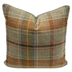 a brown plaid pillow on a white background