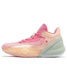 a woman's pink and green sneaker with white soles on the side