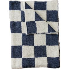 the blue and white checkered blanket is folded up