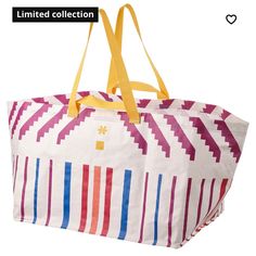 a multicolored tote bag with yellow handles and straps on the handle is shown against a white background