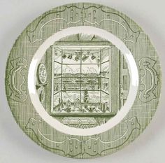 a green and white plate with an image of a window