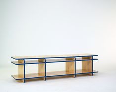 a table with two shelves on each side and blue trim around the edge, against a white background