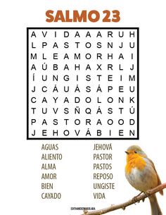 a bird sitting on top of a tree branch next to a crossword puzzle game