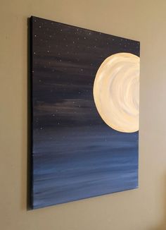 a painting hanging on the wall above a bed with a night sky and stars painted on it