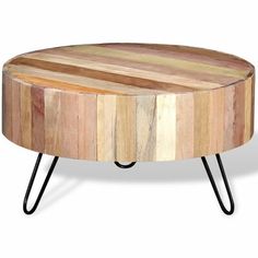 a round wooden table with black legs on an isolated white background for use as a coffee table