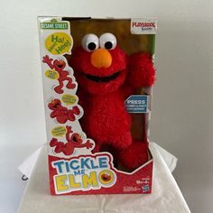 the sesame street plush toy is in its box