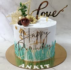 a birthday cake with the words love and happy birthday written on it's side