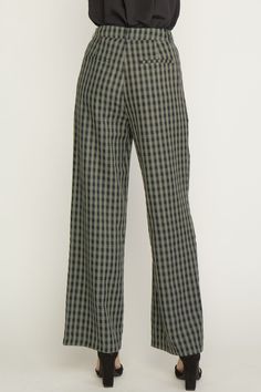 Elevate your style with our Olive Plaid Trousers! These high waisted, wide leg pants feature a playful gingham print and functional pockets. Belt loops and a zipper front closure add convenience and the lining offers comfort for all-day wear. Amp up your work wardrobe with these fun and functional trousers. 75% Polyester 25% Rayon Chic Plaid Straight Leg Bottoms, Black Wide Leg Bottoms With Houndstooth Pattern, Gingham Cotton Pants For Fall, Cotton Gingham Pants For Fall, Trendy Plaid Wide Leg Bottoms, Fall Gingham Cotton Pants, Chic Wide Leg Bottoms With Houndstooth Pattern, Chic Gingham Wide Leg Pants, Gingham Cotton Bottoms For Fall