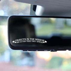 a rear view mirror with the words objects in the mirror and other things on it