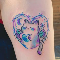 a watercolor tattoo with a cat on it's arm and an angel wing