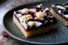 two pieces of dessert sitting on top of a plate