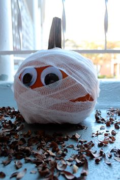 an orange and white ball covered in plastic wrap