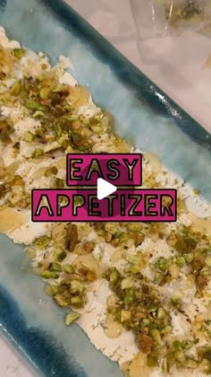 an easy appetizer recipe made with pistachios and white rice on a blue platter