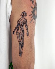 a man's arm with a tattoo on it that has a drawing of a woman