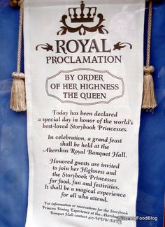 the royal proclaimation banner is hanging on a blue wall