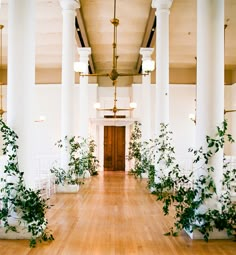 the instagram page on instagram shows an image of a hallway with white columns and greenery