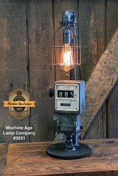 an old fashioned lamp on top of a wooden table