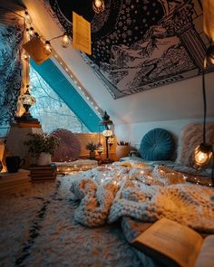 an attic bedroom is decorated in warm colors and cozy lighting, with books on the floor