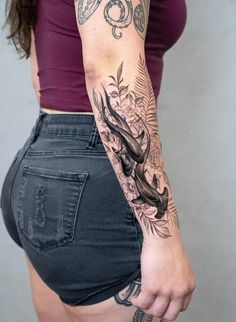 a woman with a tattoo on her arm