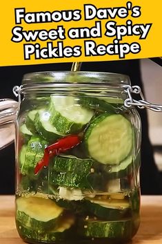 a jar filled with pickles on top of a wooden table