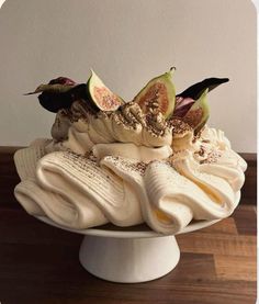 a cake with bananas, figurines and other toppings on top of it