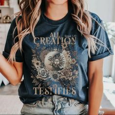 a woman wearing an all creation tee shirt