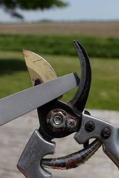 a pair of scissors that are attached to some kind of tool