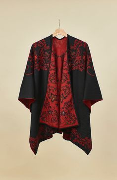 Gorgeous Alpaca poncho in red and black colors with colorful embroidered accents. Beautiful, warm, and cozy. One size fits all, this poncho is quite stunning and will become your go-to garment. It is reversible, the same coloring, with different portions of Black/Red on each side. Fabric: 50% superfine Alpaca, 50% acrylic. Made Certified Fair Trade in Peru. One size fits all. Alpaca fiber contains very little lanolin, which makes it hypoallergenic and easier to tolerate even for people with wool Traditional Red One-size Poncho, Traditional Red Shawl Poncho, Traditional Red Poncho For Fall, Traditional Red Fall Poncho, Winter Embroidered Long Sleeve Poncho, Red Shawl Outerwear For Winter, Red Poncho For Festival In Fall, Red Shawl Poncho For Festival, Red Fall Festival Poncho