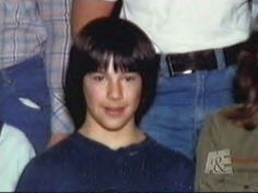 an old photo of a young boy smiling at the camera with other people in the background