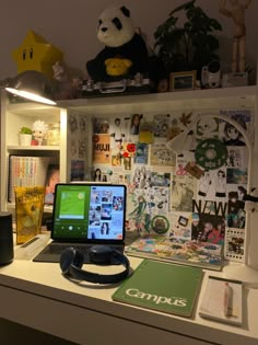 a laptop computer sitting on top of a desk