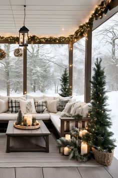 a covered porch with christmas decorations and candles