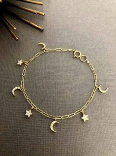 "Crescent Moon and star bracelet, birthday gift, Paper, Dainty Moon bracelet, Gift for her, Moon and star charm bracelet The word \"crescent\" comes from the Latin word \"crescere,\" meaning to grow. We are always learning and growing as people, and this elegant, Charm embodies the strong symbolism of the ever-changing moon. --------------------------------------------------------------------- ** DETAILS ** - 7 Moon and Star charms Up to 6.5\" long bracelet - 8 Moon and Star charms for  7\" and 7.5\" -9 Moon and Star charms for 8\" and 8.5\" - 10 Moon and Star charms for 9\" and 9.5\" ---------------------------------------------------------------------- ** FEATURES ** - 18K Gold Vermeil Paperclip Chain - Gold filled Clasp - Cubic Zirconia - Gold Plated over Brass moon and star charms ---- Celestial Charm Bracelet With Moon Charm As A Gift, Celestial Charm Bracelet With Star Charm As Gift, Celestial Moon Charm Bracelet As Gift, Celestial Star Charm Bracelet Gift, Celestial Moon Charm Bracelet For Gift, Star Charm Bracelet, Learning And Growing, Crescent Moon And Star, Pretty Accessories