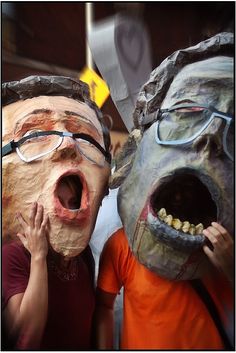 two children wearing masks with their mouths open