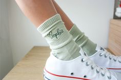 "💎💍  Make a fashionable statement on your big day! Step up your style with these \"Customizable Embroidered Sage Green Bridal Socks\" 👰💖 📢 PLEASE WRITE THE WORDS YOU WOULD LIKE TO BE WRITTEN FOR EACH PAIR IN THE ORDER NOTE SECTION FOR YOUR TEXTS LONGER THAN 2 WORDS. OTHERWISE, THE ENTIRE TEXT YOU HAVE WRITTEN WILL BE EMBROIDERED ON EACH SOCK. (SUCH AS; \"BRIDE\" FOR ONE PAIR AND \"2024\" FOR THE OTHER PAIR etc.) Our socks are fully customizable and crafted with love, just for you. Choose from Mrs. Mr. socks, Made of Honor socks, Name socks, Bride socks, and more! Push your imagination to the limits; I'm here for you💕 Not only will these socks be a perfect accessory for bride and her bridesmaids on wedding day, but they also make a fantastic gift idea for the bride-to-be bestie! With Bridal Socks, Bridesmaid Socks, Bachelorette Accessories, Made Of Honor, Embroidered Socks, Wedding Socks, Bachelorette Gifts, Industrial Wedding, Style Expert