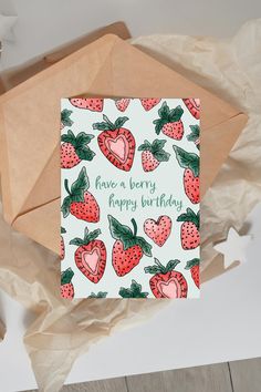 a card with strawberries on it and the words have a berry happy birthday