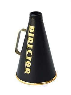 a black and gold cone shaped object with the word director on it's side