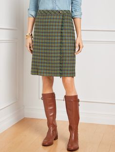 For work and beyond. A wrap-inspired silhouette defines our A-line style skirt. In a charming plaid pattern with on-trend fringe detail at the front. Features A-Line Hits Above Knee Concealed side zip closure Lined Imported Fit: Misses: 20 1/2"; Petite: 19 1/2"; Plus: 22 1/2"; Plus Petite: 20 1/2" Material: Shell: 48% Wool, 27% Polyester, 25% Viscose; Lining: 100% Polyester Care: Machine Wash Cold; Only Non-Chlorine Bleach When Needed; Turn Garment Inside Out; Line Dry; Cool Iron, If Needed | Fr Talbots Outfits, Wool Plaid Skirt, Red Plaid Skirt, Preppy Women, Tweed Pencil Skirt, Knee Length Skirt Pencil, Printed Pleated Skirt, Work Clothing, Wrap Maxi Skirt