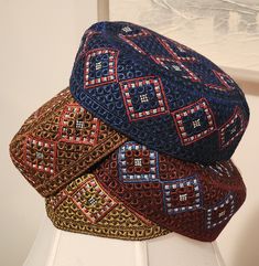 three hats are sitting on top of each other