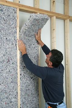 a man is working on the insulation in his house