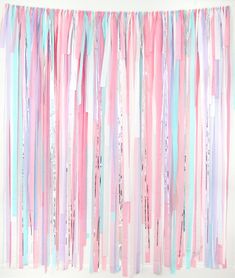 pink, blue and white streamers hanging from the ceiling