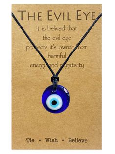 the evil eye necklace is on display in front of a card with an inspirational quote